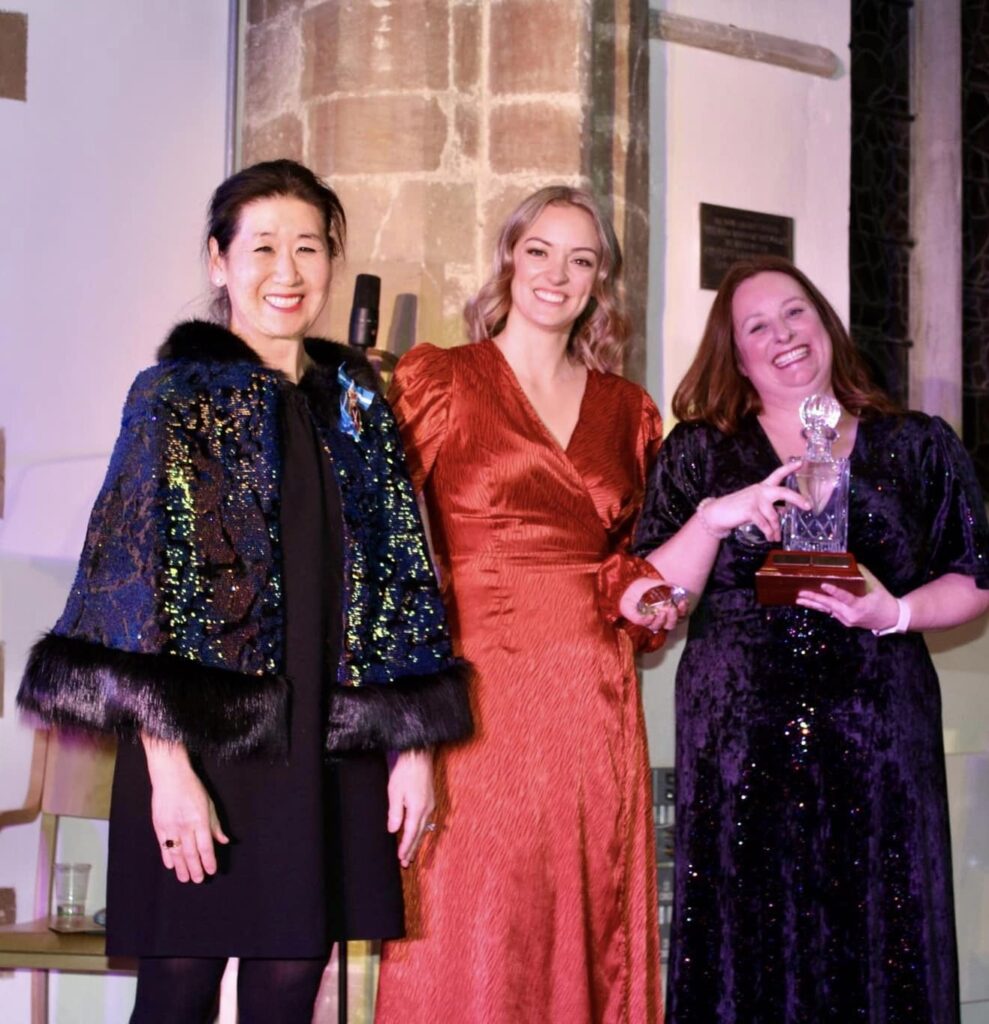 Emily Thompson & Ruth Lo with His Majesty's Lord Lieutenant Mrs J Crompton - The Josh Schumann Show Must Go On Award